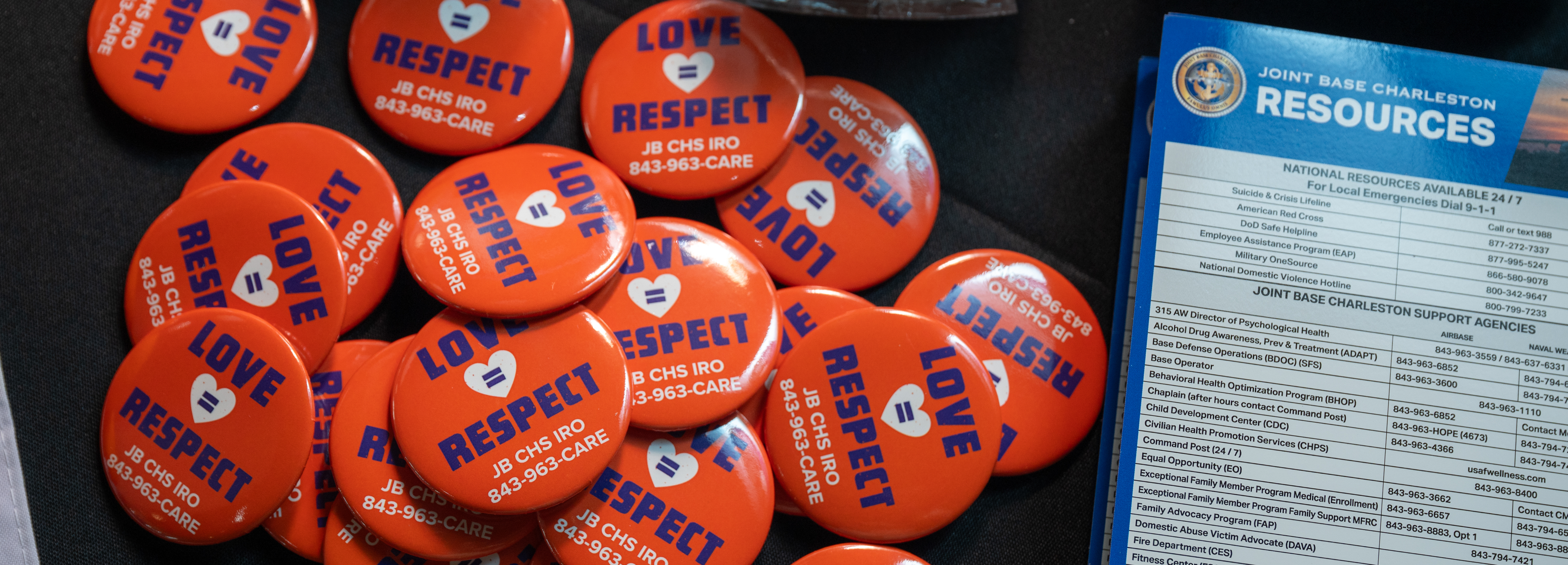 Informational resources on teenage dating violence awareness are presented on a table.
